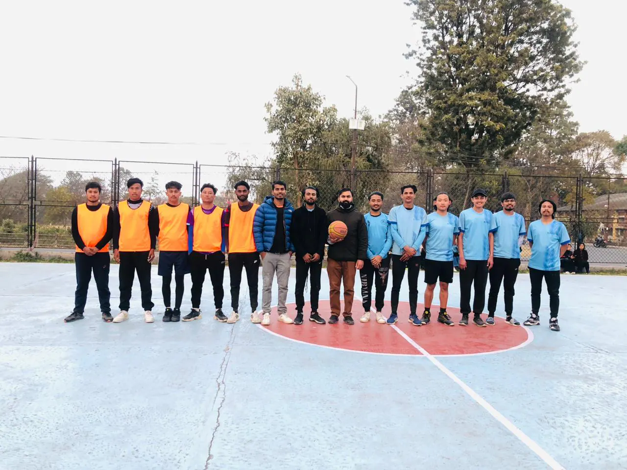 Two ICE student teams lined up across the campus court before a match